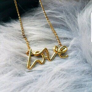 Dainty gold love script necklace